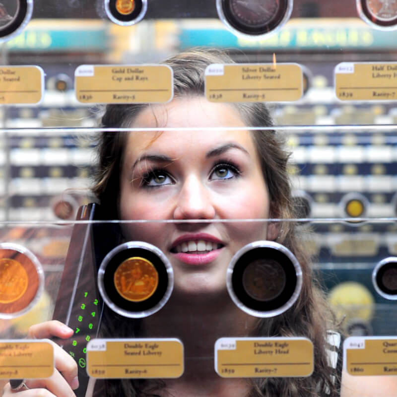 teen girl looking at coins